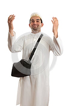 Ethnic man with arms raised in praise
