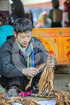 Ethnic minority man selling cigarettes, at old Van market