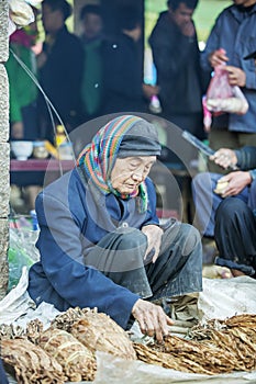 Ethnic minority man selling cigarettes, at old Van market