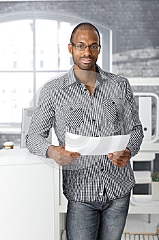 Ethnic office worker smiling