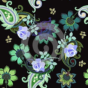 Ethnic seamless pattern with green paisley, fabulous flowers and blue roses on black background