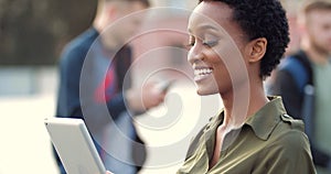 Ethnic young woman holds computer tablet in her hands modern digital device, speaks looks into webcam, online conference