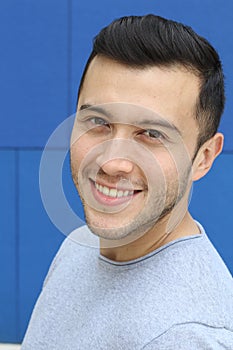Ethnically ambiguous male smiling close up