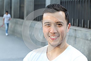 Ethnically ambiguous male smiling with copy space photo