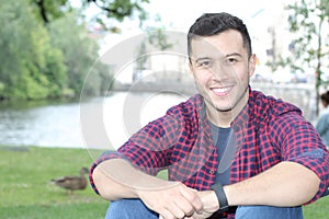 Ethnically ambiguous male smiling with copy space photo