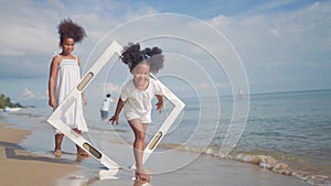 Ethnicity Happy Family Africans Enjoy playing on the beach summer vacation time photo