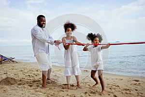 Ethnicity Happy Family Africans Enjoy playing on the beach summer vacation time happiness