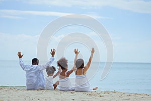 Ethnicity Happy Family Africans Enjoy relaxation resting on the beach summer vacation time