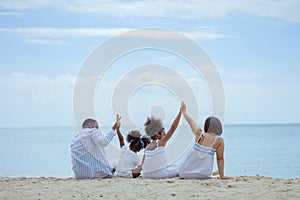 Ethnicity Happy Family Africans Enjoy relaxation resting on the beach summer vacation time