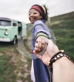 Ethnicity happy woman hold hand of beloved man