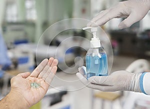 Ethyl alcohol sanitizer in a hand of the doctor for cleaning hand and used as disinfectant,Covid-19,Corona virus.