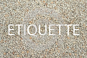 Etiquette - word on stone background as blank for design photo