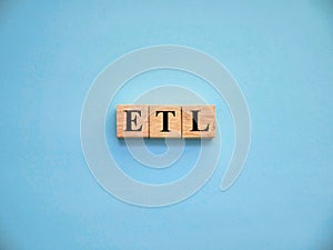 ETL Extract transform and load, text words typography written on wooden lettering, life and business motivational inspirational photo