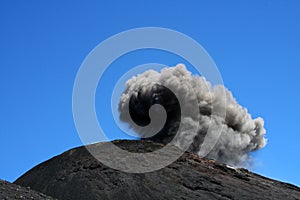 Etna crater erupting in daytime