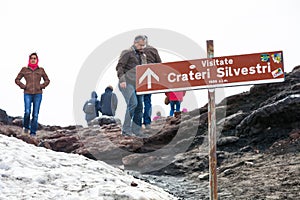 Some people practice walking and trekking on the top of Mount Etna in Sicily in Italy