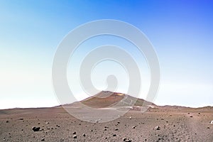Etna - vista sul deserto lavico e su un cratere laterale durante giornata estiva di  sole e cielo blu photo