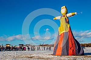 Large effigy in the form of a woman in traditional Russian dress, spring holiday Maslenitsa