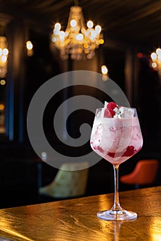 Eton mess raspberry and marshmallow alcoholic cocktail at the bar