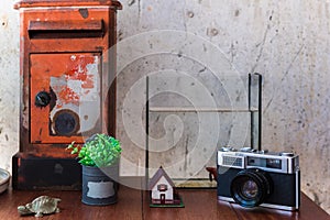 Etro of camera and mail box with rustic of table photo
