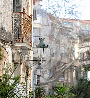 ÃÂ¡etro house, old metal hanging lantern, rusty iron balcony background