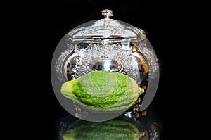 Etrog with Silver box. Sukkot Jewish custom photo