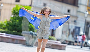 EU Flag. Cute happy girl with the flag of the European Union. Yo