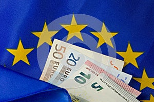 EU flag and Euro notes photo