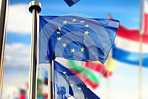EU flags waving over blue sky. Brussels, Belgium