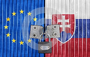 EU and Slovakia flag on door with padlock