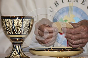 Eucharist and break consecrated Host