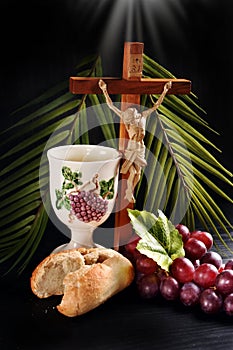 Eucharist symbol with bread  grape and cross with Jesus on black background