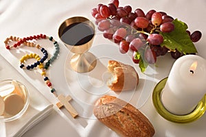 Eucharistic elements on table with white tablecloth
