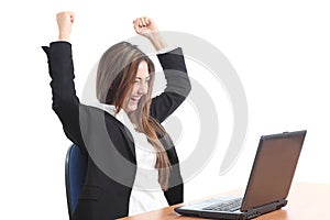 Euphoric business woman watching a laptop photo