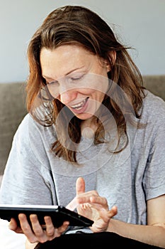 Euphoric girl social networking addiction at breakfast time