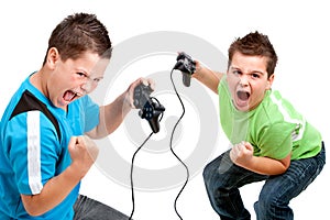 Euphorious boys playing with video consoles