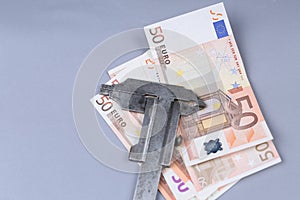 Euro background and a caliper