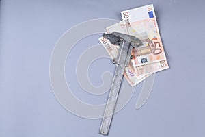 Euro background and a caliper