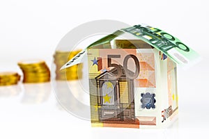 Euro bank notes House and coins