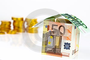 Euro bank notes House and coins