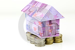 Euro bank notes House and coins