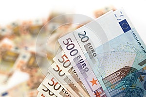 Euro banknote on a blured background of money