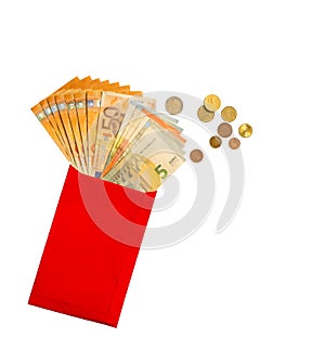 The Euro Banknote money in a red paper envelope, golden, silver and bronze coins, isolated on white background with clipping path