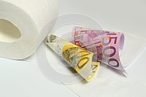 Euro banknote and toilet paper