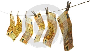 The Euro banknotes attached with clothespins on the rope