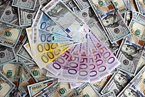 Euro banknotes on a background of one hundred dollars banknotes