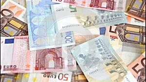 Euro banknotes are blown away
