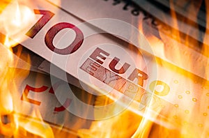 Euro banknotes burning