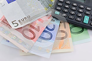 Euro banknotes and calculator