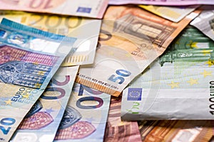 Euro banknotes in detail on the pile of other nominal banknotes