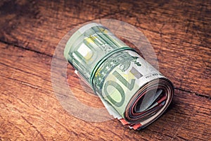 Euro banknotes. Euro currency. Euro money. Close-up Of A Rolled Euro Banknotes On concrete or Wooden table